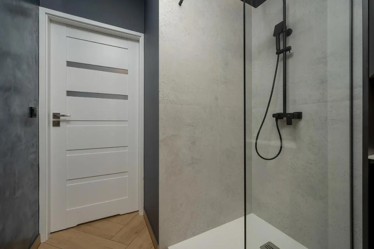 Black And Beige Apartment With Balcony And Parking In Wroclaw By Noclegi Renters Polska